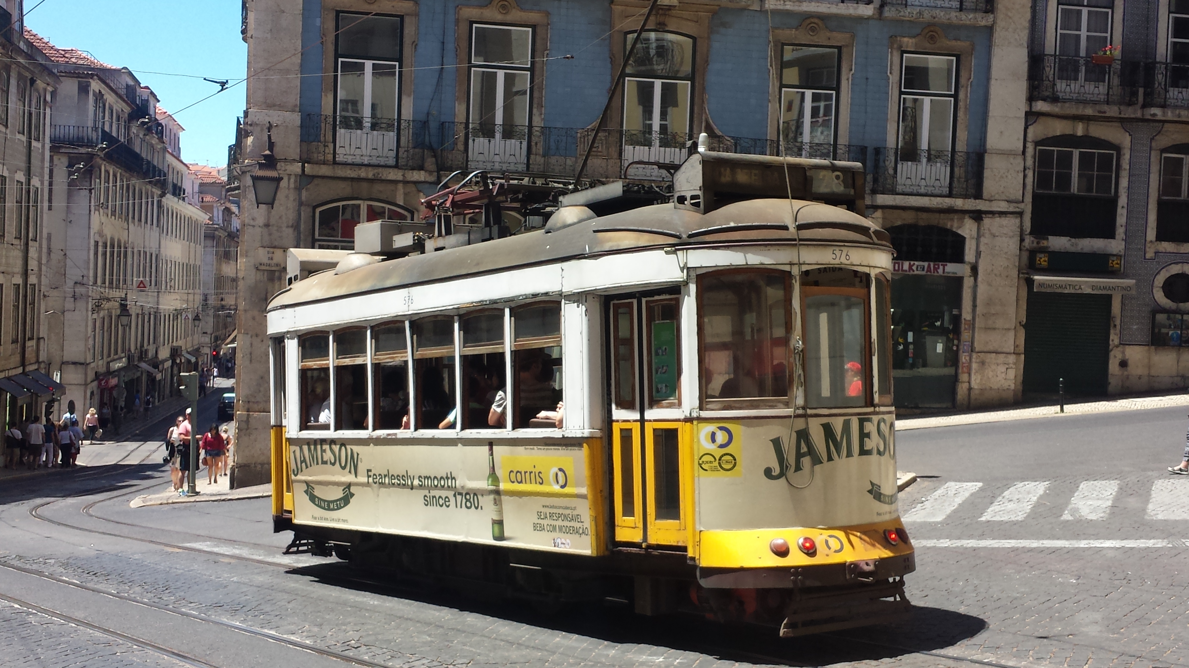 Vintage cable-car cruises down Lisbon streets